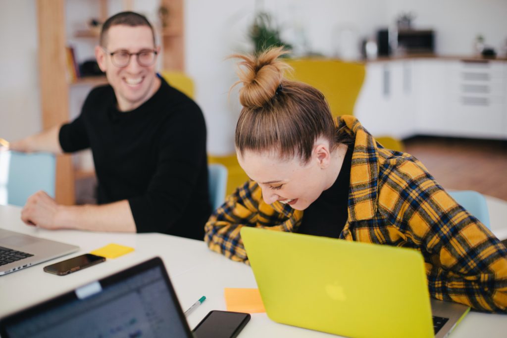 Male and female communicating in office